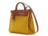 Hermès’ Jaune de Naples Toile and Vache Hunter Herbag Zip 31