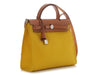 Hermès’ Jaune de Naples Toile and Vache Hunter Herbag Zip 31