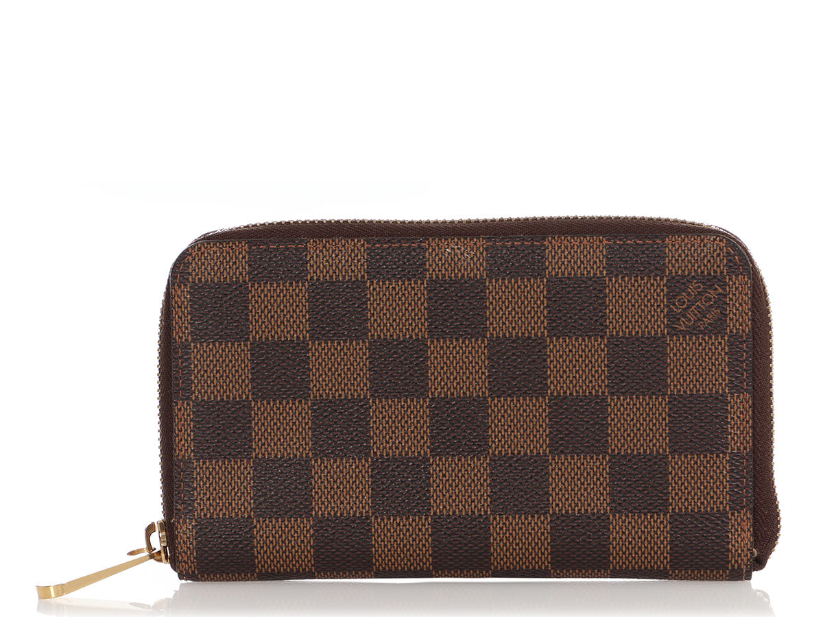 Louis Vuitton brown/tan Damier zip wallet. Beautiful interior with